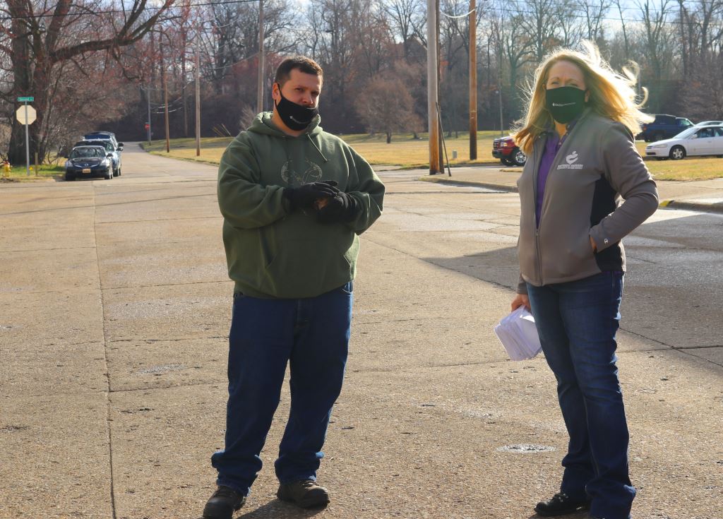 Staff assisting food delivery